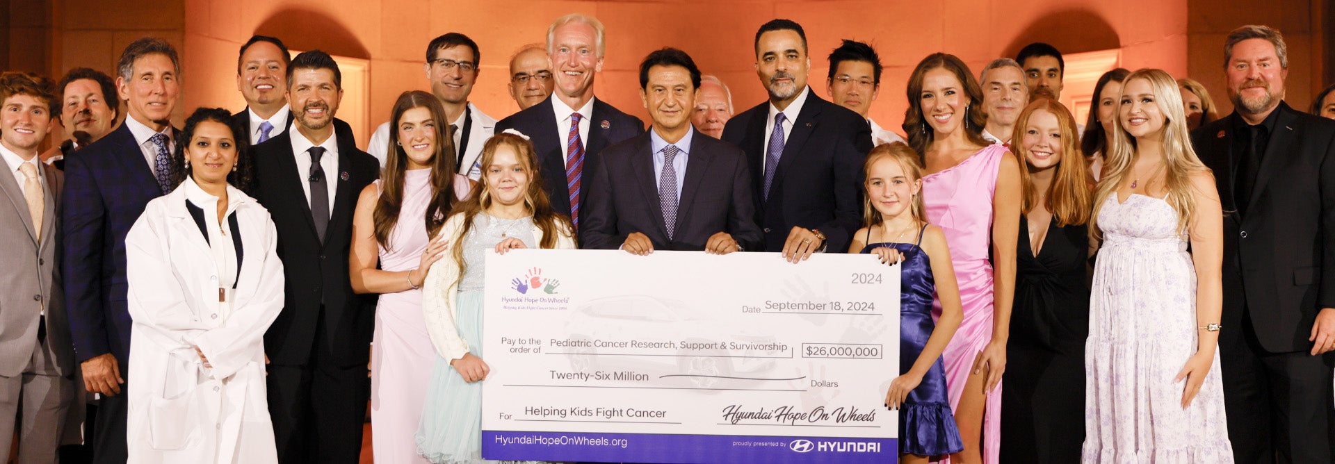 helping kids fight cancer foundation showing their big check from hyundai hope on wheels - Manly Hyundai in Santa Rosa CA